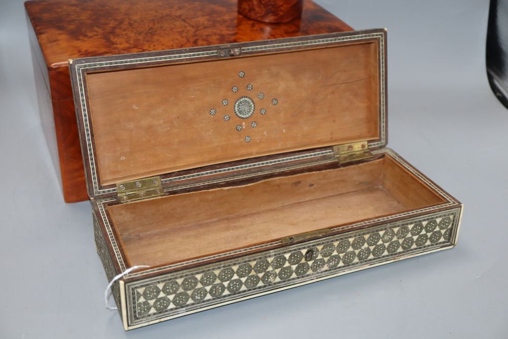 An amboyna jewellery box, 30 x 18 x 14cm, a pen stand and a Damascus box